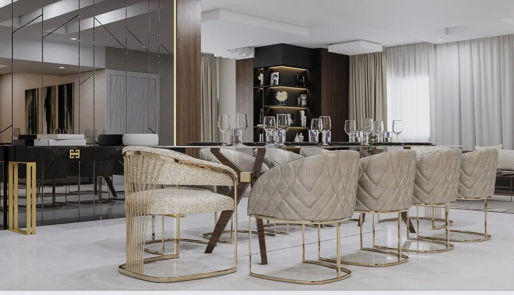 Salle à manger aux chaises dorées et meuble de rangement éclairé